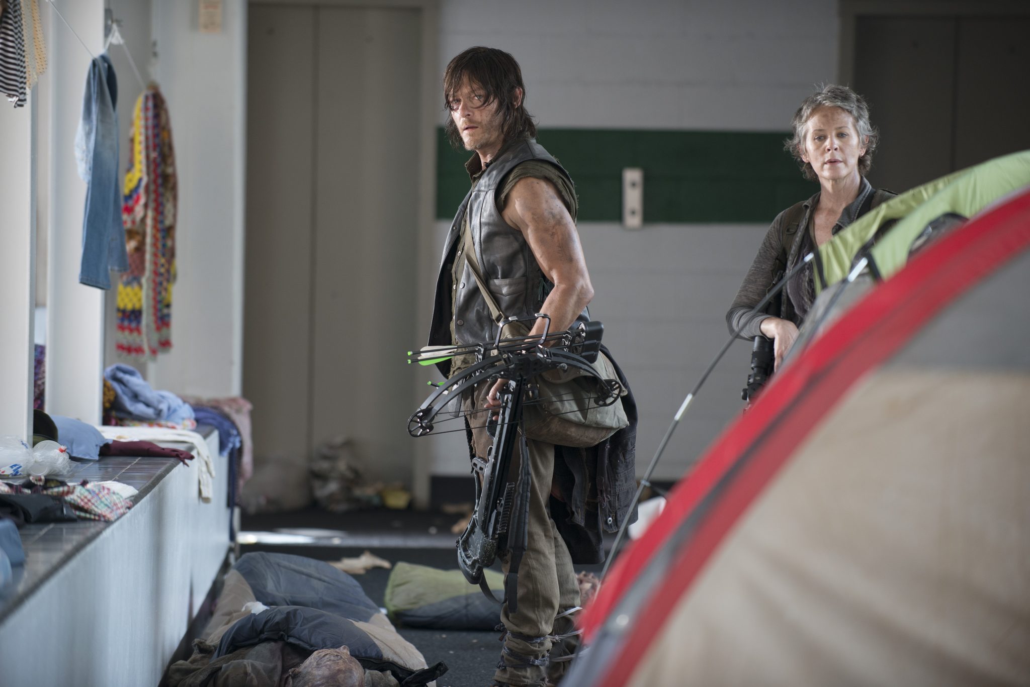 Walking Dead Daryl and Carol encounter zombies in tents. Photo: Gene Page/AMC