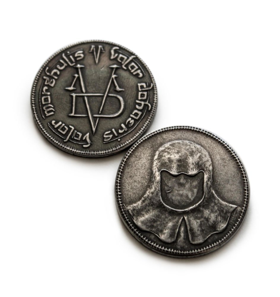front and back of the faceless men coin from braavos