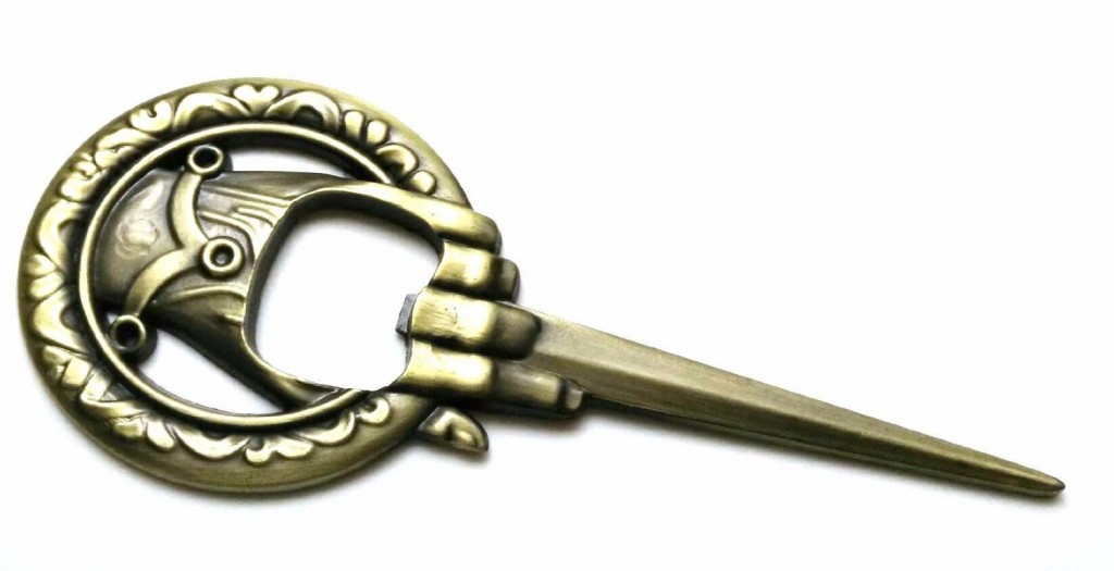 a metal bottle opener that looks like the game of thrones hand of the king pin