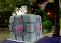 A wedding cake that looks like the companion cube from Portal