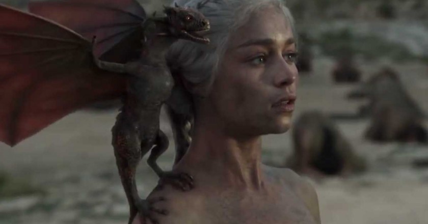 A dragon sits on the shoulder of Danaerys Targaryen