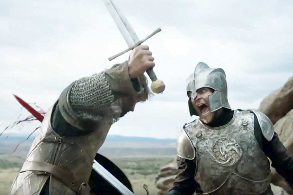 A man in targaryen armor runs another man through with his sword.