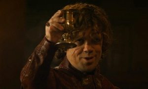 tyrion lannister raises a glass of wine