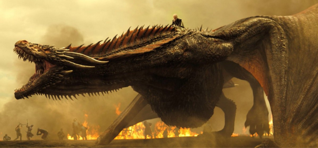Dany from game of thrones rides her dragon drogon