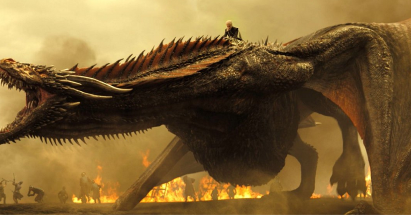 Dany from game of thrones rides her dragon drogon