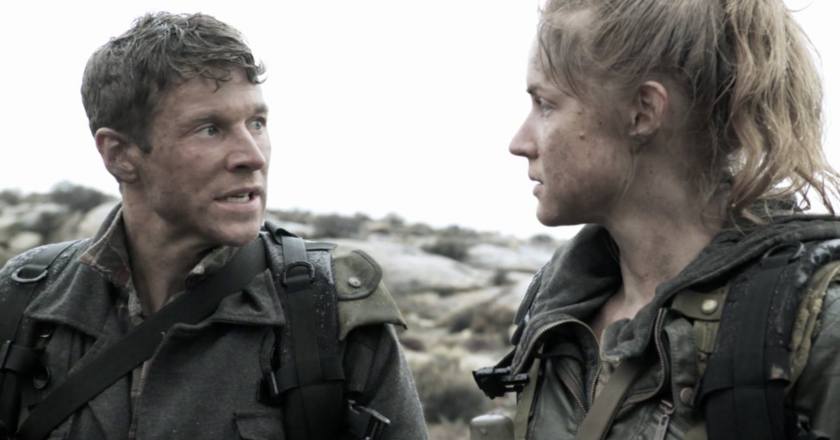 a man and a woman talk in a post apocalyptic world