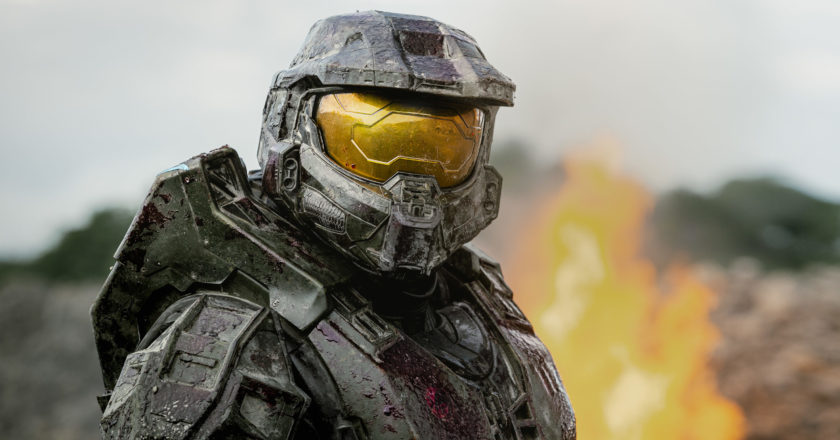Master Chief stares at the camera with fire in the background