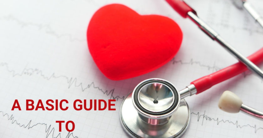 A red heart and a stethoscope on a white ekg paper with waves